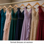 formal dresses uk women elegant boutique display with stylish evening gowns in satin, chiffon, and lace fabrics on hangers in a luxury fashion store